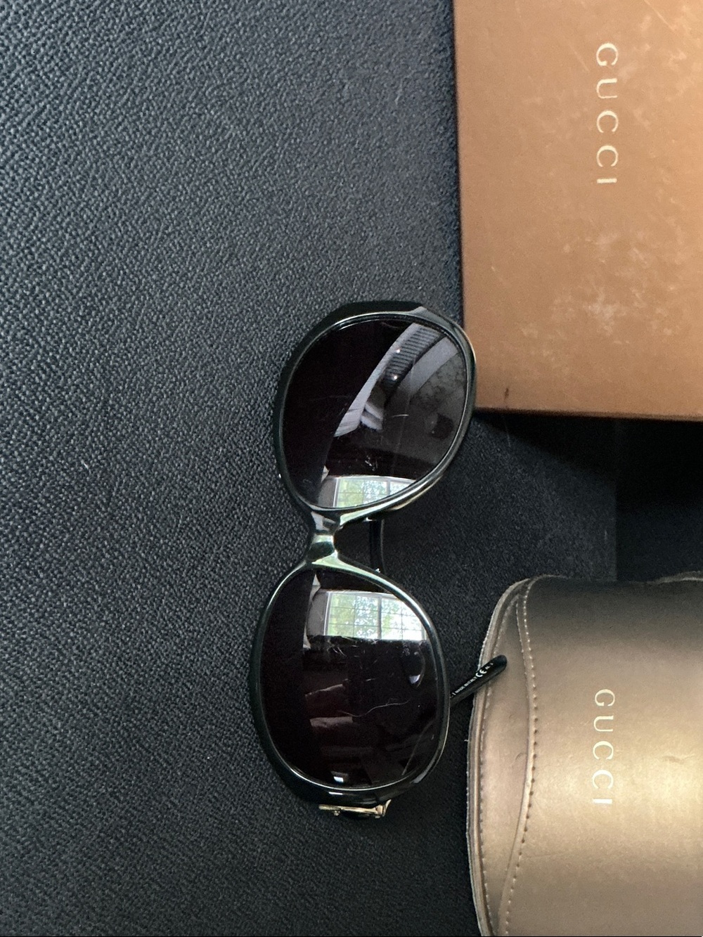Gucci Black Womens Oval Sunglasses with Dark Lenses